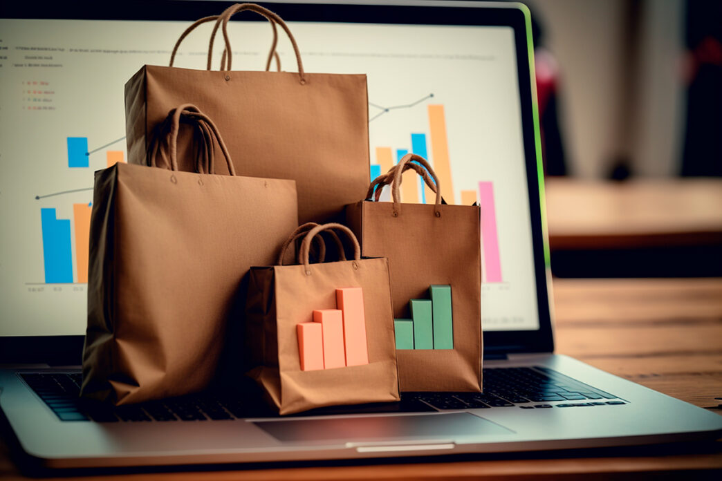 Bolsas de la compra sobre un ordenador con estadísticas.